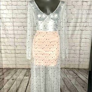 Destination dress, sheer with pink underlay. Sequins on the dress.